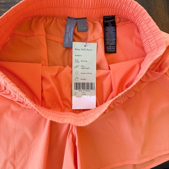 Sweaty Betty Relay Shell Orange Athletic Shorts - Picture 8 of 8